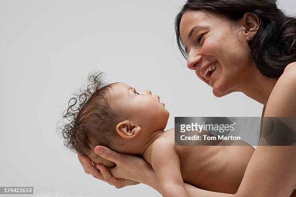 a baby being held - baby studio bildbanksfoton och bilder