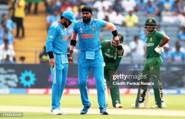 Hardik Pandya of India reacts in their follow through after bowling during the ICC Men's Cricket World Cup India 2023 between India and Bangladesh at...