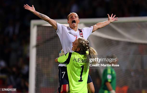 Trine Roenning of Norway celebrate with team mate Ingrid Hjelmseth after winning the UEFA Women's Euro 2013 semi final match between Norway and...