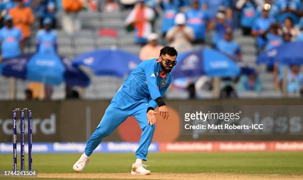 Virat Kohli of India in bowling action during the ICC Men's Cricket World Cup India 2023 between India and Bangladesh at MCA International Stadium on...