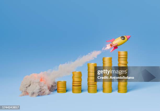 Rocket flying over the stacks of coins on blue background