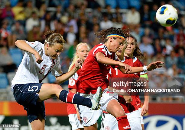 Norway's defender Toril Akerhaugen and Denmark's forward Nadia Nadim vie for the ball during the UEFA Women's European Championship Euro 2013 semi...