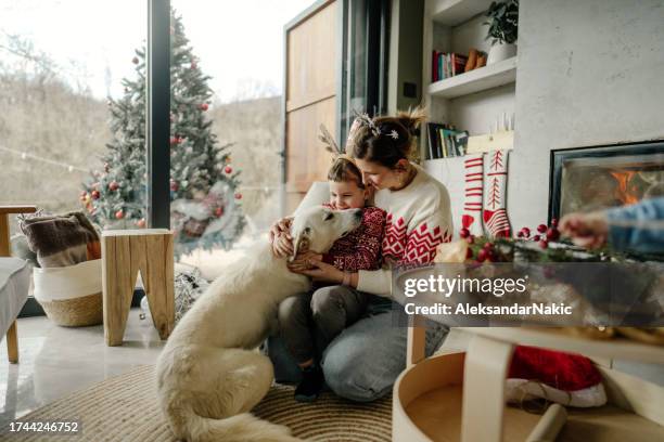 magical christmas moments for mommy and me - hug christmas stock pictures, royalty-free photos & images