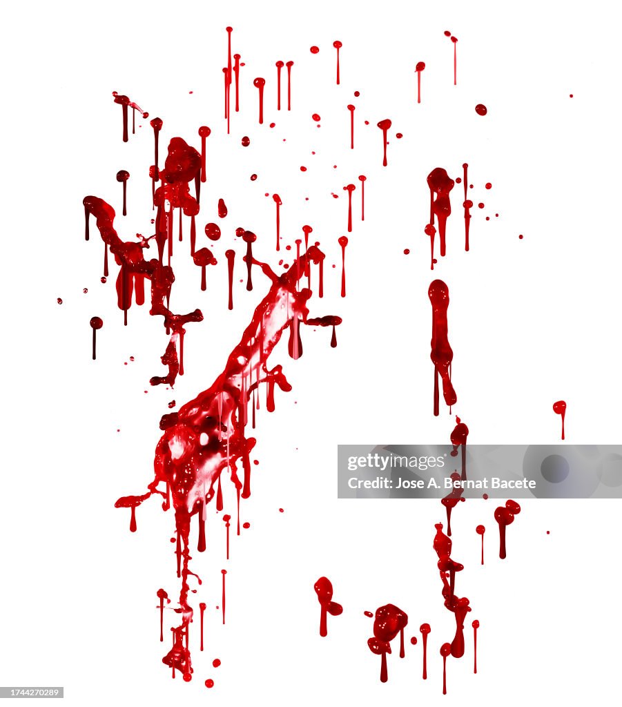 Splashes and drops of blood slide down a white wall.