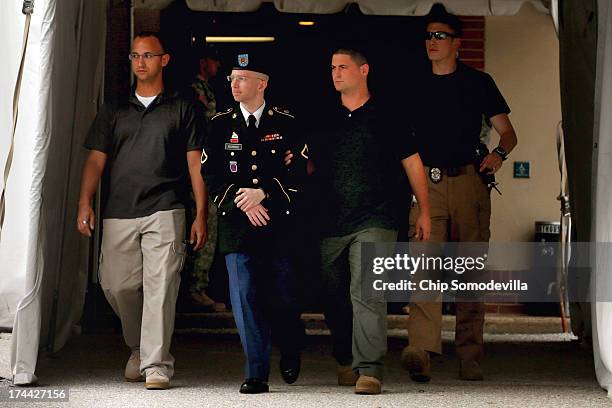 Army Private First Class Bradley Manning is escorted by military police as he leaves after the first day of closing arguments in his military trial...