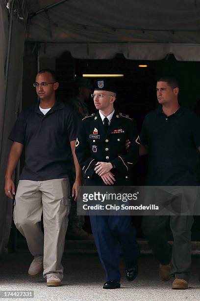 Army Private First Class Bradley Manning is escorted by military police as he leaves after the first day of closing arguments in his military trial...