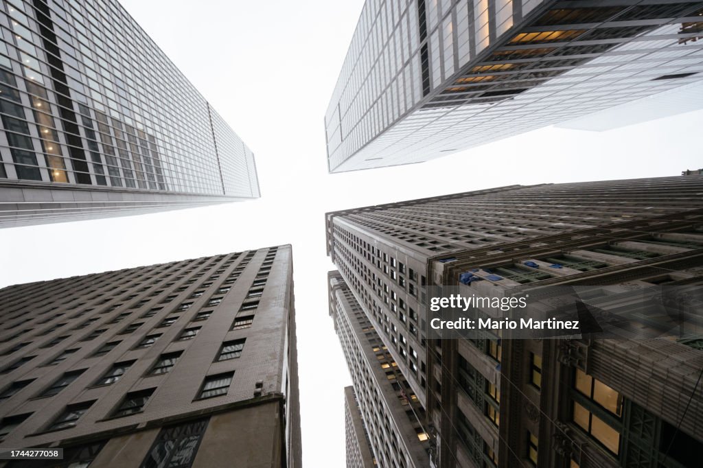 Looking up at skyscrapers from Manhattan crossroad