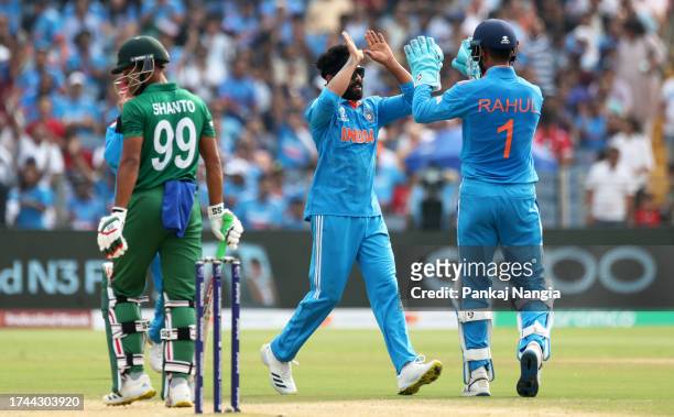 Ravi Jadeja of India celebrates the wicket of Najmul Hossain Shanto of Bangladesh during the ICC Men's Cricket World Cup India 2023 between India and...