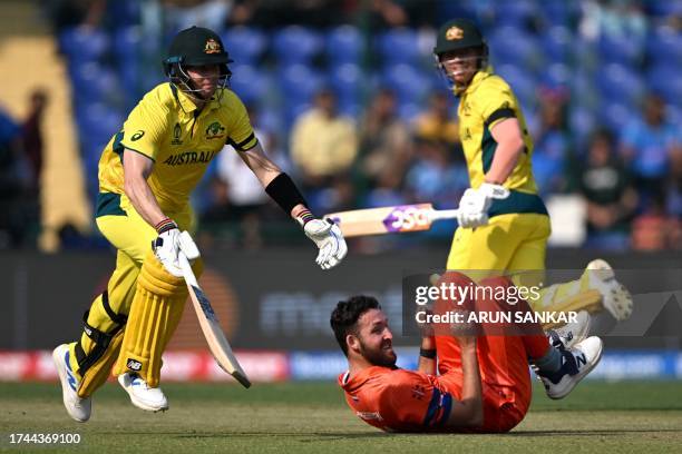 Australia's Steve Smith and David Warner run between the wickets as Netherlands' Paul van Meekeren watches during the 2023 ICC Men's Cricket World...