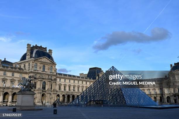 This picture taken on October 24, 2023 shows Louvre Pyramid, designed by Chinese-American architect Ieoh Ming Pei, standing at the Louvre museum in...