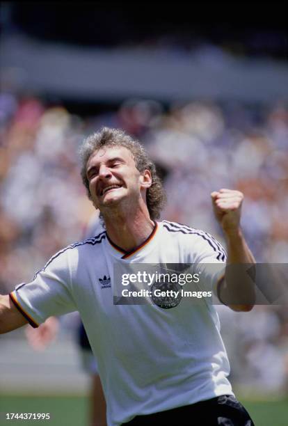 Rudi Voller of West Germany celebrates after scoring the first goal during the 1986 FIFA World Cup match between West Germany and Scotland on June...