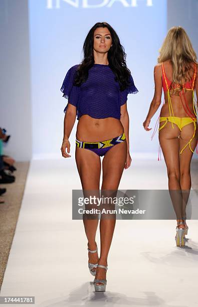 Model walks the runwau during the Indah fashion show at Mercedes-Benz Fashion Week Swim 2014 at Raleigh Hotel on July 22, 2013 in Miami Beach,...