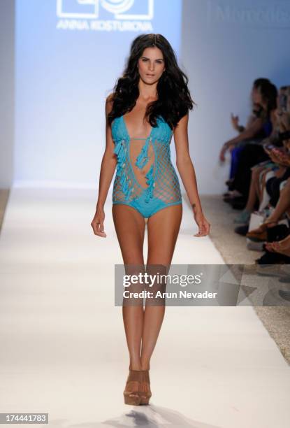 Model walks the runway during the Anna Kosturova fashion show at Mercedes-Benz Fashion Week Swim 2014 - Runway at Raleigh Hotel on July 22, 2013 in...