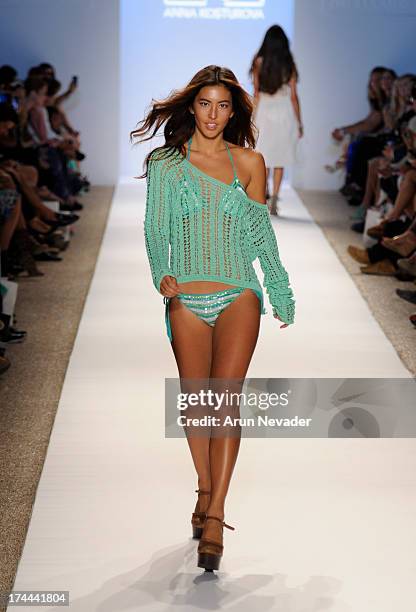 Model walks the runway during the Anna Kosturova fashion show at Mercedes-Benz Fashion Week Swim 2014 - Runway at Raleigh Hotel on July 22, 2013 in...