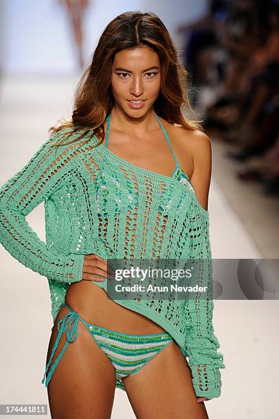 Model walks the runway during the Anna Kosturova fashion show at Mercedes-Benz Fashion Week Swim 2014 - Runway at Raleigh Hotel on July 22, 2013 in...