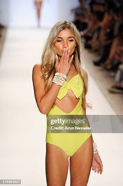 Model walks the runway during the Lolli Swimwear fashion show at Mercedes-Benz Fashion Week Swim 2014 - Runway>> at Raleigh Hotel on July 22, 2013 in...