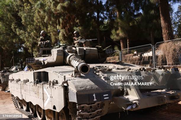 An Israeli army Merkava tank is positioned in the Upper Galilee area near the Lebanon border on October 25, 2023. Persistent rocket and artillery...
