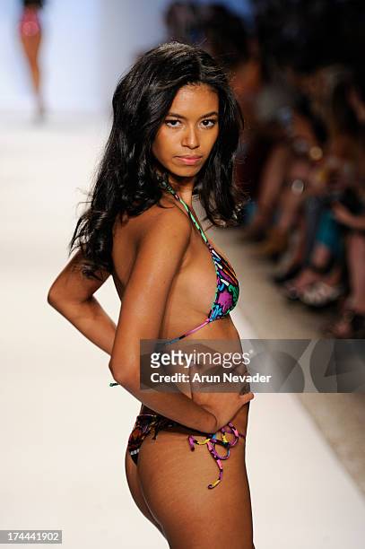 Model walks the runwau during the Indah fashion show at Mercedes-Benz Fashion Week Swim 2014 at Raleigh Hotel on July 22, 2013 in Miami Beach,...
