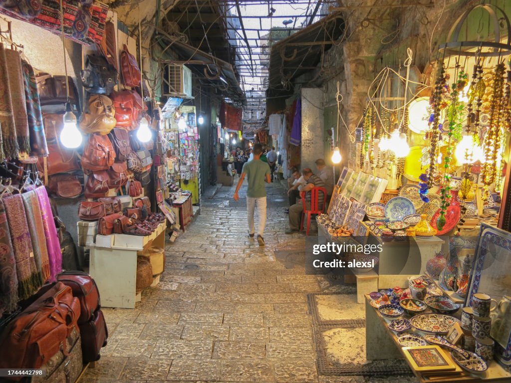 Tourists are shopping at the Jerusalem Old City arab market
