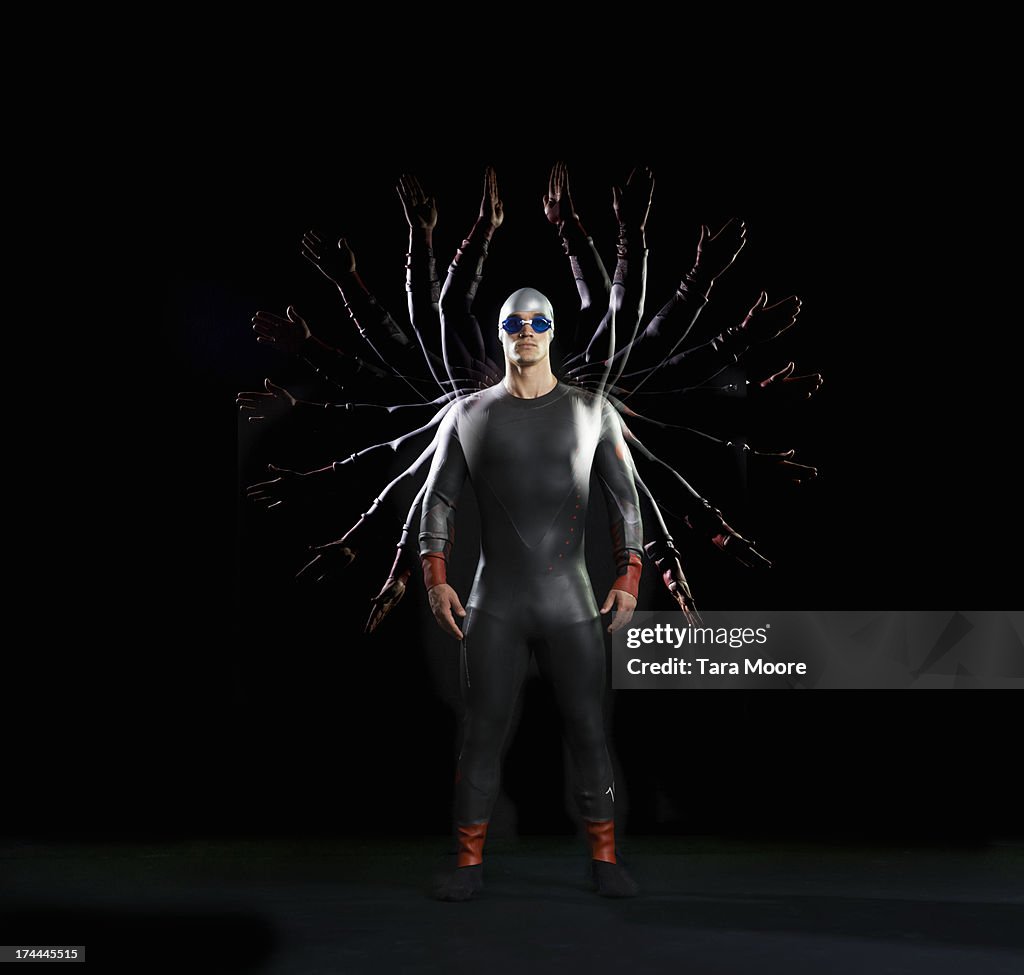 Swimmer in wetsuit with multiple strobe