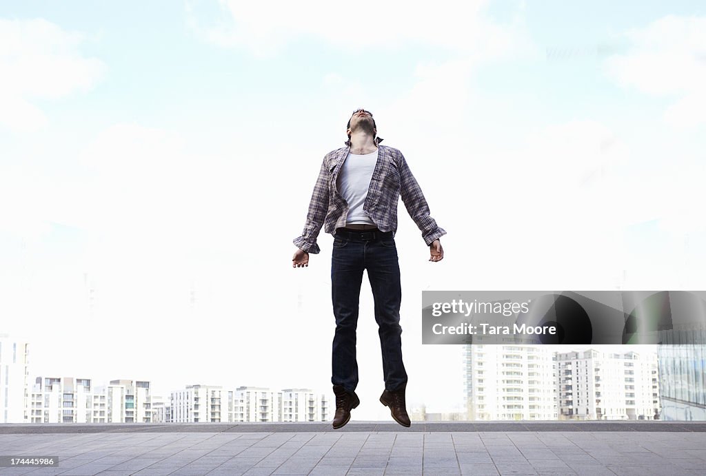 Man jumping in city