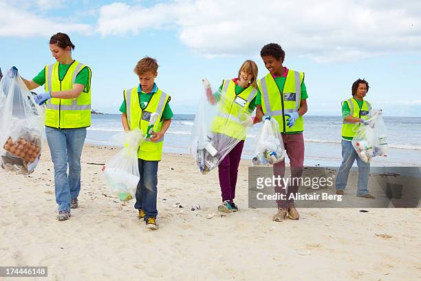 Cleaning Up Trash On Beach Photos and Premium High Res Pictures - Getty ...