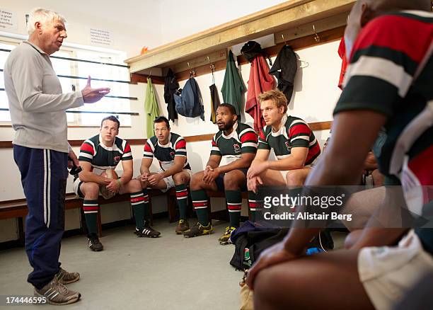 rugby players in changing room - rugby sport stock-fotos und bilder