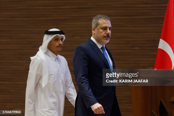 Qatar's Prime Minister and Foreign Minister Mohammed bin Abdulrahman al-Thani and Turkey's Foreign Minister Hakan Fidan hold a press conference in...
