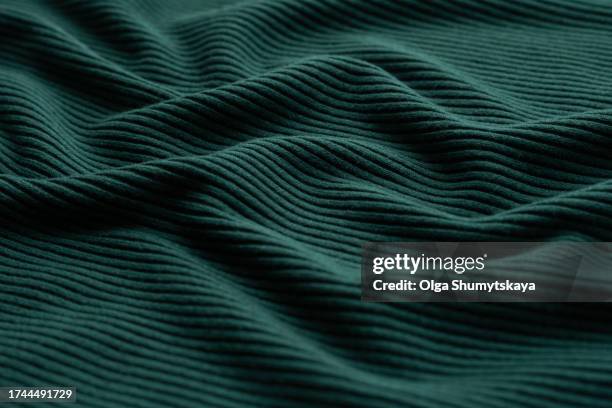 green wavy background. - textile manufacturing stock pictures, royalty-free photos & images