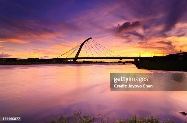 water reflection of dazhi bridge at sunset - keelung stock pictures, royalty-free photos & images