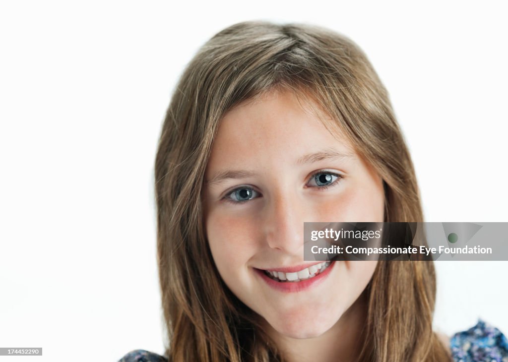 Close up portrait of smiling girl (11-12)