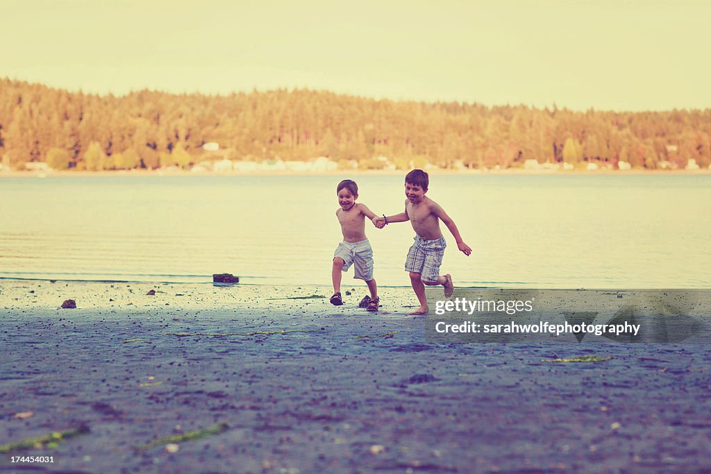 Children running on beach