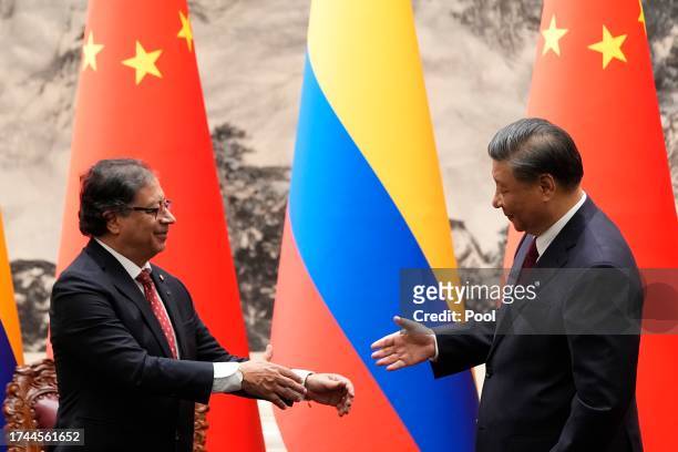 Chinese President Xi Jinping shakes hands with Colombian President Gustavo Petro during a signing ceremony held at the Great Hall of the People on...