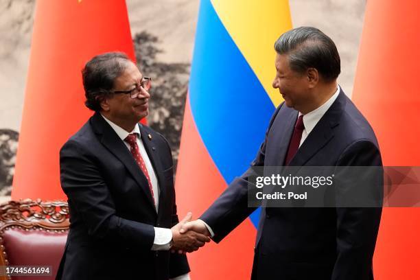 Chinese President Xi Jinping shakes hands with Colombian President Gustavo Petro during a signing ceremony held at the Great Hall of the People on...