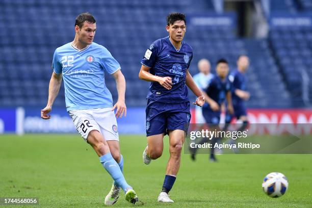 Good of Melbourne City FC goes past Supachai Chaided of Buriram United during the AFC Champions League Group H match between Buriram United and...