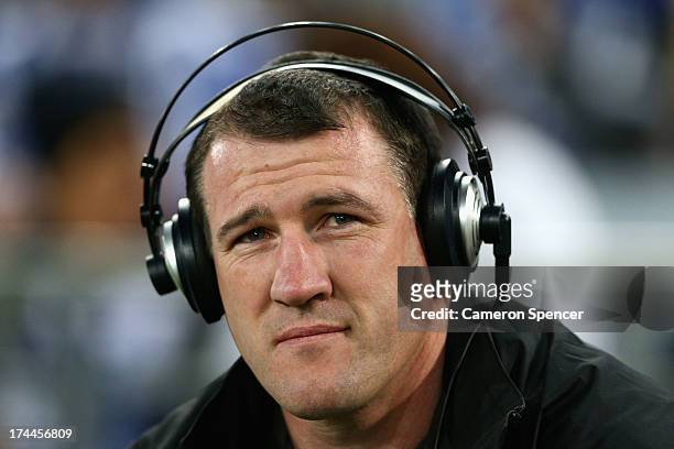 Injured Sharks captain Paul Gallen commentates from the sideline during the round 20 NRL match between the Canterbury Bulldogs and the Parramatta...