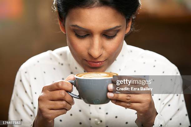 woman about to drink a cup of coffee. - tomando cafe fotografías e imágenes de stock