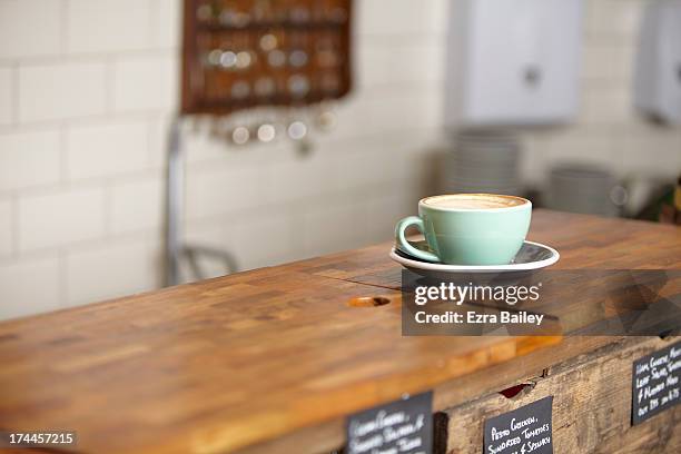 cup of coffee in a mint green mug. - coffee cup foto e immagini stock