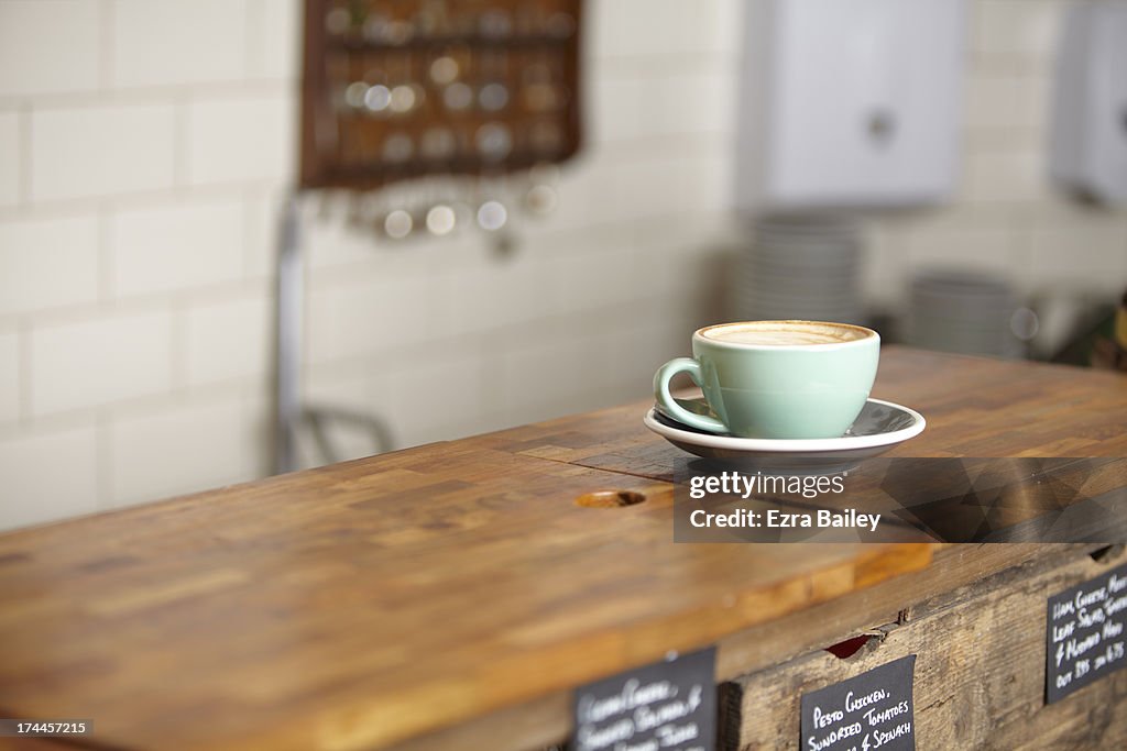 Cup of coffee in a mint green mug.