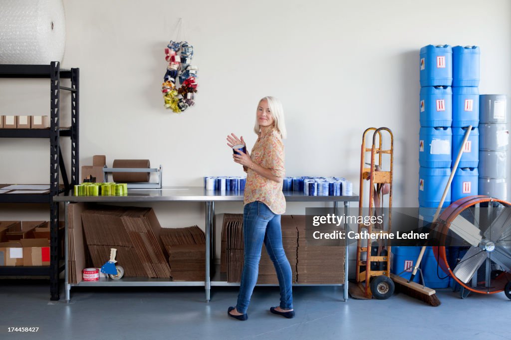 Woman Holding Candle at Factory