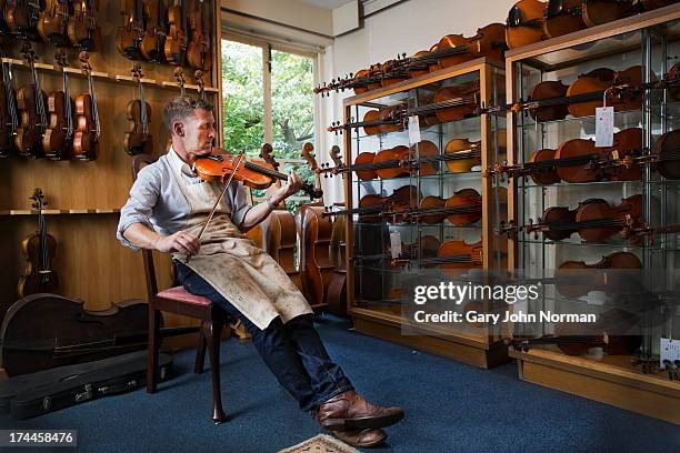 man playing violin - violin stock pictures, royalty-free photos & images