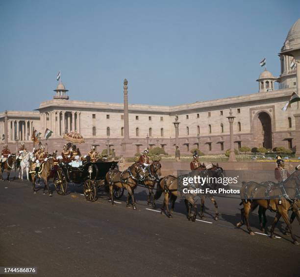 Queen Elizabeth II and the Duke of Edinburgh, accompanied by President Rajendra Prasad, leave the Rashtrapati Bhavan presidential palace in an open...