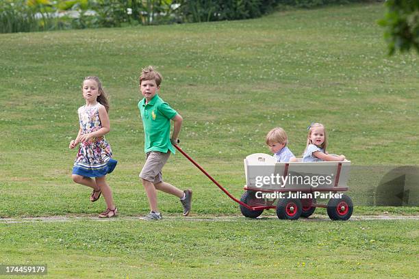 Prince Christian,and Princess Isabella of Denmark, pull their brother and sister Prince Vincent, and Princess Jospehine along, while attending the...