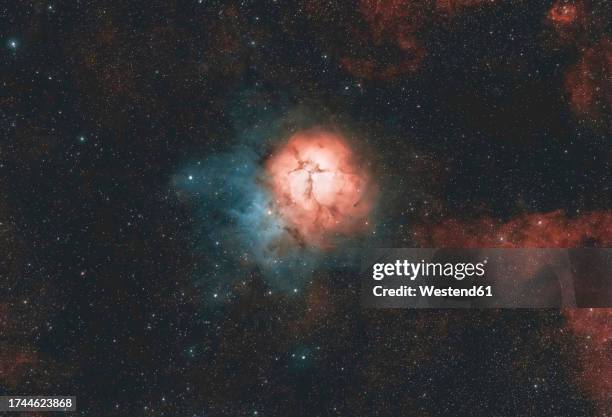 view of trifid nebula in sagittarius constellation - the archer stock pictures, royalty-free photos & images