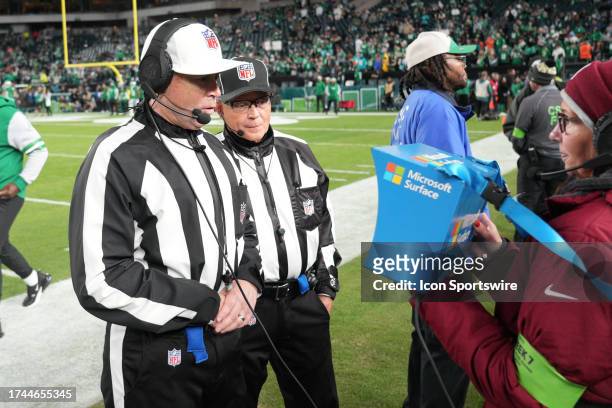 Referee Brad Allen checks the instant replay during the game between the Miami Dolphins and the Philadelphia Eagles on October 22, 2023 at Lincoln...