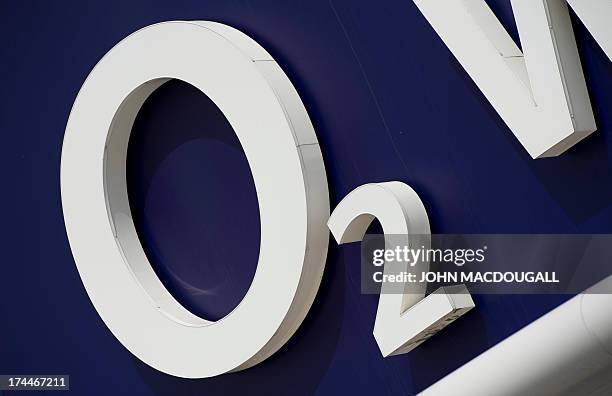 Logo of European broadband and telecommunications giant O2 is pictured in Berlin on July 26, 2013. O2 and telecommunication company E-plus are set to...