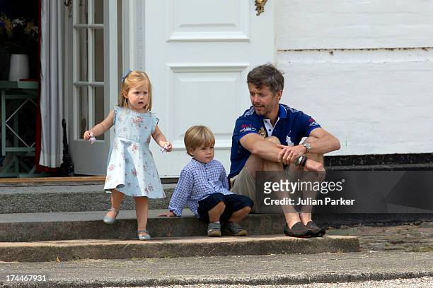Crown Prince Frederik of Denmark, with Prince Vincent and Princess Josephine watch the changing of the Guard at Grasten Castle after the annual...