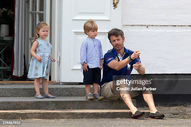 Crown Prince Frederik of Denmark, with Prince Vincent and Princess Josephine watch the changing of the Guard at Grasten Castle after the annual...