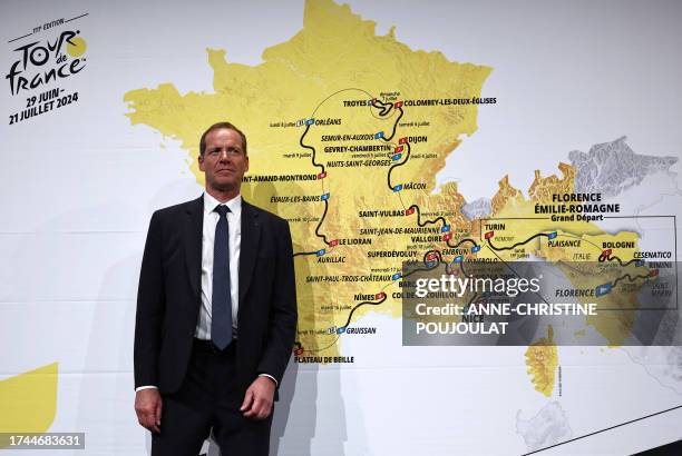 Tour de France General Director Christian Prudhomme poses in front of the map, showing the men's route, during the presentation of the official...