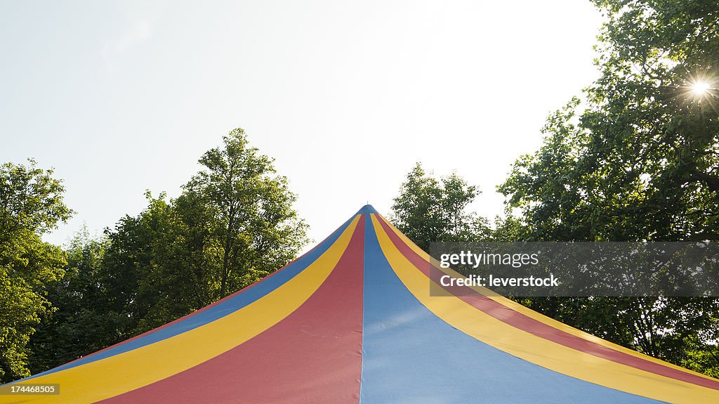 A big top tent in a field